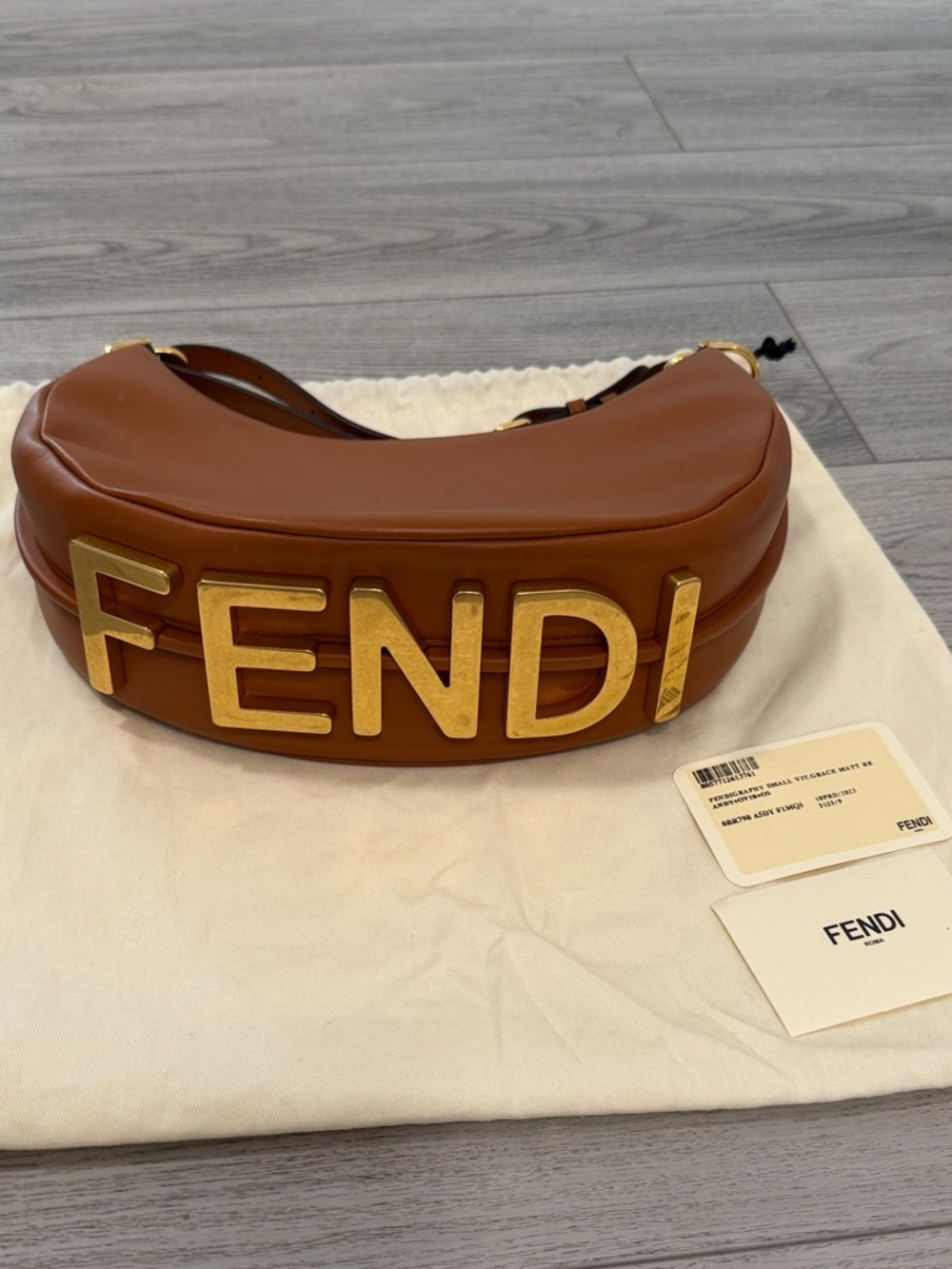 Fendi Tan Leather Logo Baguette with Gold Lettering